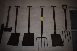 Items on Wall Three Shovels, Two Forks, and an Axe