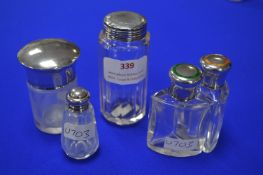 Five Glass Jars with Hallmarked Sterling Silver Li