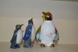 Three Penguin Figures