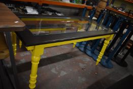 *Yellow Painted Table with Dark Wood and Glass Ins