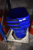 *Three Blue Plastic Baskets with Wheels and a Plas