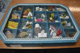 Display Case Containing Miniatures and Novelties