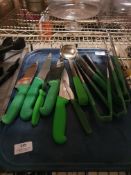 * quantity of green handled utentils and knives