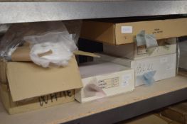 *Shelf of Various Coloured Doilies