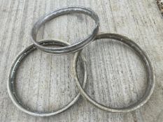 Three motorcycle rims, two appear to have been rechromed.