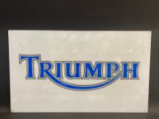 A rectangular Triumph plastic advertising sign, probably the front panel from a lightbox, 39 x 23