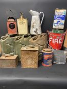 A collection of assorted cans including three jerry fuel cans and also a fire bucket.