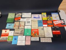 Two boxes of assorted garage related ephemera, stickers etc.