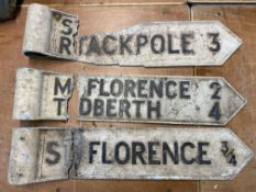Three damaged road signs.