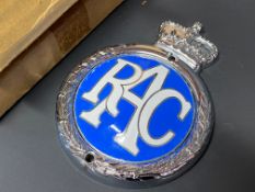 An RAC chrome plated brass and enamelled badge, brand new old stock in original box.
