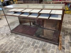 A large Victorian/Edwardian mahogany framed shop counter display cabinet, unusually having a high