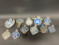 11 assorted RAC badges.