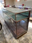 A large Victorian/Edwardian mahogany framed shop counter display cabinet, unusually having a high