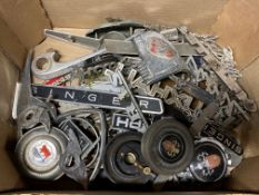 A box of motor car insignia, badges etc.
