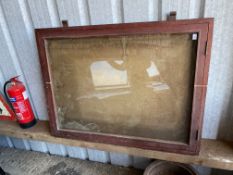 A large wall mounted glass fronted display cabinet, possibly railway station, 36