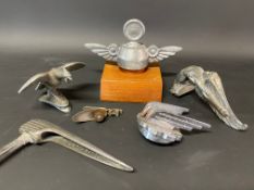 A selection of car mascots including Mack.