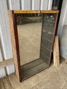 A large mirror backed front opening display cabinet, 39 1/2