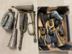 A box of assorted bulb horn parts.
