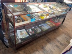 A large Victorian/Edwardian mahogany framed shop counter display cabinet, unusually having a high