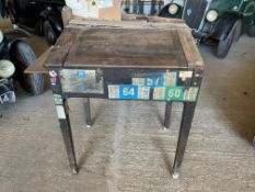 An early 20th Century desk with rising lid, as removed from a garage and still with sundry