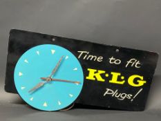 A K.L.G. Plugs garage showroom advertising wall clock, 18 x 10