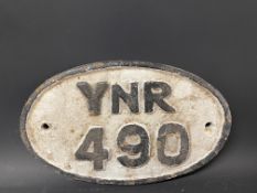 A small oval cast iron plaque, YNR 490, possibly railway, 9 1/2 x 6