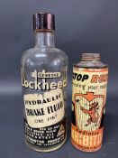 A Lockheed Hydraulic Brake Fluid one pint glass bottle plus a Holt's radiator inhibitor tin.