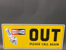 A new old stock Champion spark plug garage tin advertising sign 'Out', 23 x 10