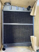 A new old stock Mini radiator core.
