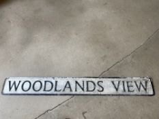 A street name sign for Woodlands View, 49 x 6