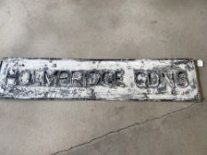 A street name sign for Holmbridge Gadns, 50 x 11