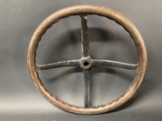 A veteran or Edwardian four spoke dished steering wheel with wooden rim, 17 1/2