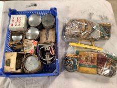 A box of various pistons and two bags of various piston rings.