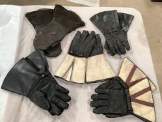 Five pairs of classic motorcycle gauntlets.