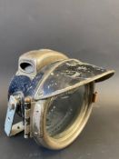 A Lucas King of The Road motorcycle headlamp with peak.