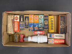 A quantity of spark plugs in original cardboard packaging plus a spark plug shaped Avon aftershave