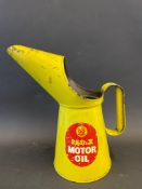 A Redex Motor Oil quart measure.