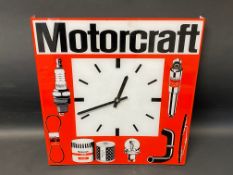 A Motorcraft plastic battery-operated garage wall clock, 15 x 15 3/4