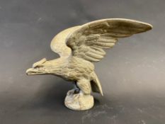 An accessory car mascot in the form of a bird of prey.