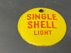 A small circular enamel brand tag for Single Shell Light, 2 3/4