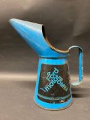 A Ford Motor Oil quart measure.