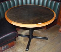 1 x Round Restaurant Table With a 105cm Diameter - Features a Two Tone Wooden Top and Cast Iron Base