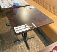 4 x Restaurant Dining Tables Featuring Cast Iron Bases and Wooden Tops With a Panel Design