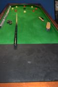 A good quility mahogany and slate base framed vintage bagatelle table on heavy legs. the table