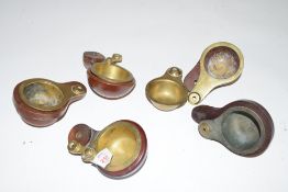 A collection of brass and hardwood billiard chalk holders, varying designs, largest piece 12cm