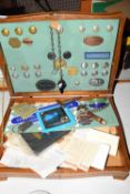 Wooden table top cabinet containing various assorted railway related badges, a card sign marked '