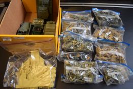 Box containing various unpainted plastic model soldiers, tanks, disassembled plastic house