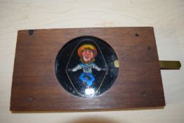 Vintage moving magic lantern slide depicting a skipping man, 17.5cm long