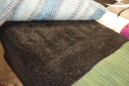 Black tufted rug, 80cm wide