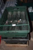 Three crates of Kilner milk bottles